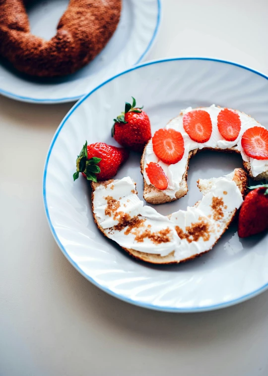 there are three slices of bread with strawberries on it