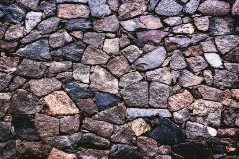 the sidewalk is lined with rocks and gravel