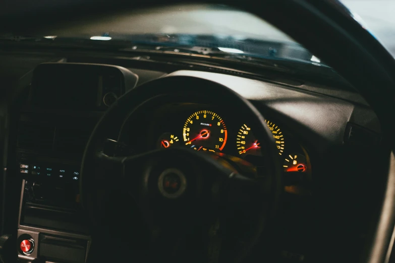 the interior of a car with dashboard lights