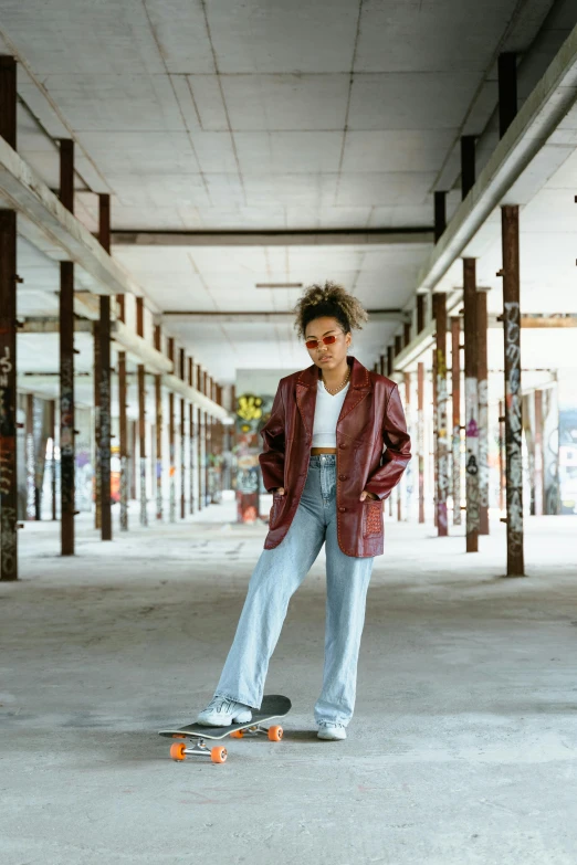 a skateboarder is standing in a large parking garage