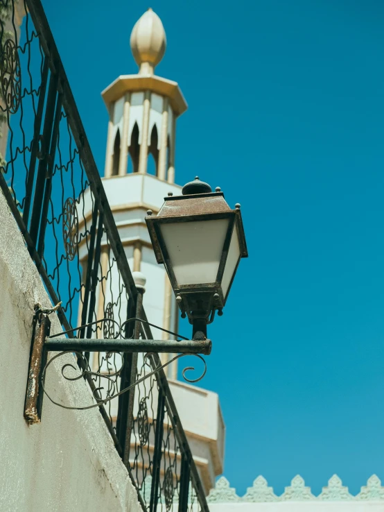 a tall white and gold building with a clock tower