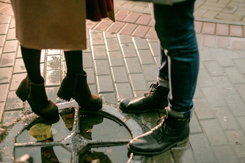 three people are standing in dles on the ground