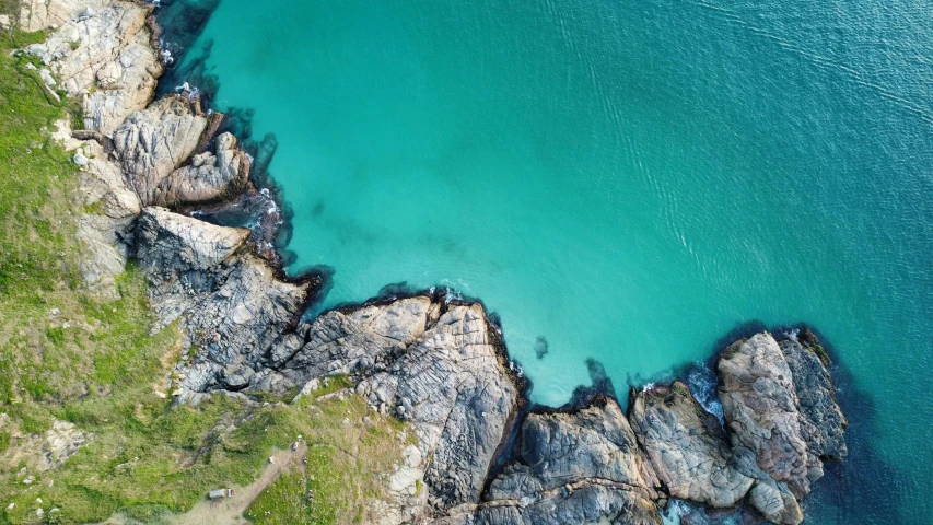 a large body of water surrounded by rocky coast