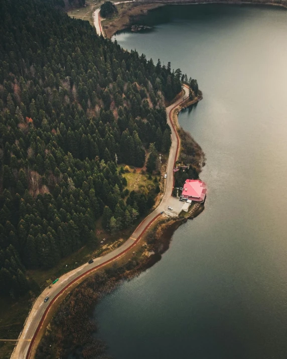 a large body of water with a road leading up to it