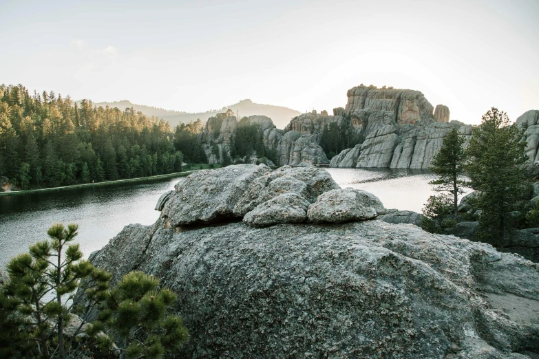 a view of a lake next to a mountain