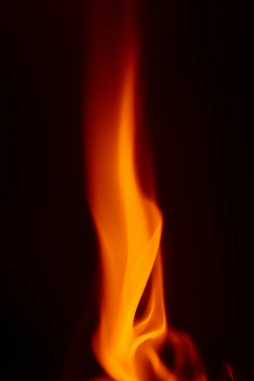 blurry picture of flames on black background