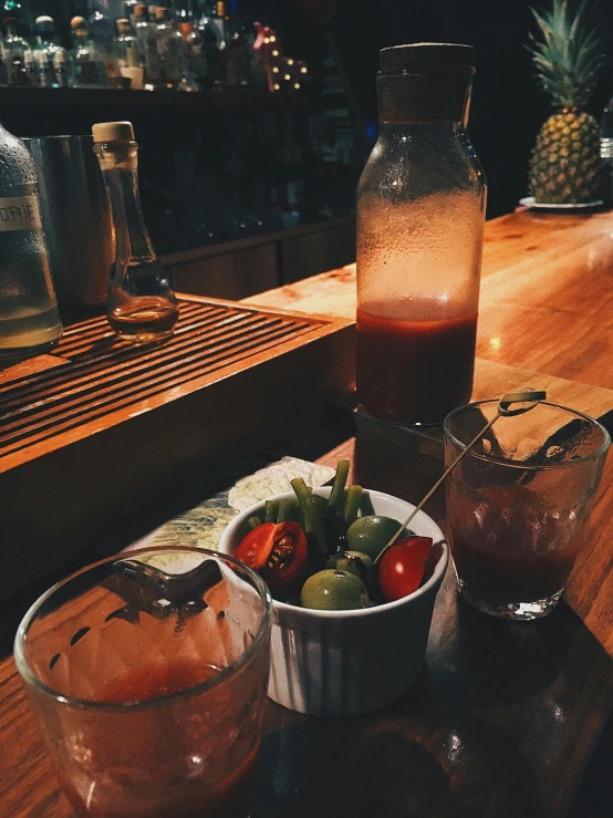 small containers of food are sitting on a wooden table