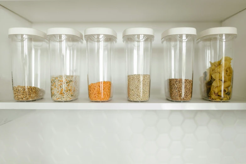 a shelf filled with lots of different containers and items