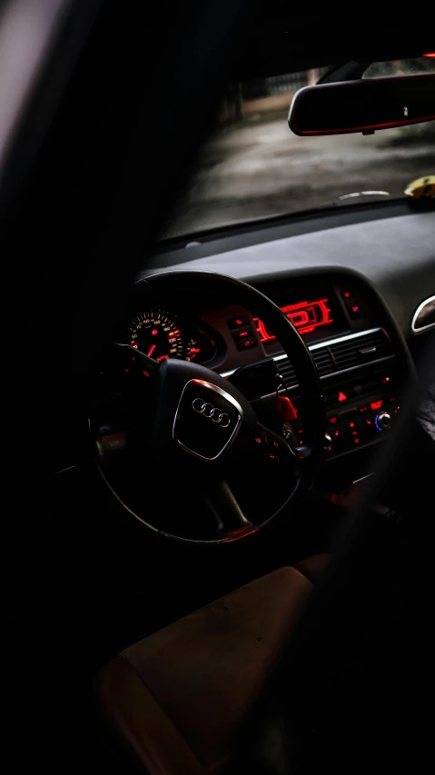 the dashboard and interior of an automobile at night