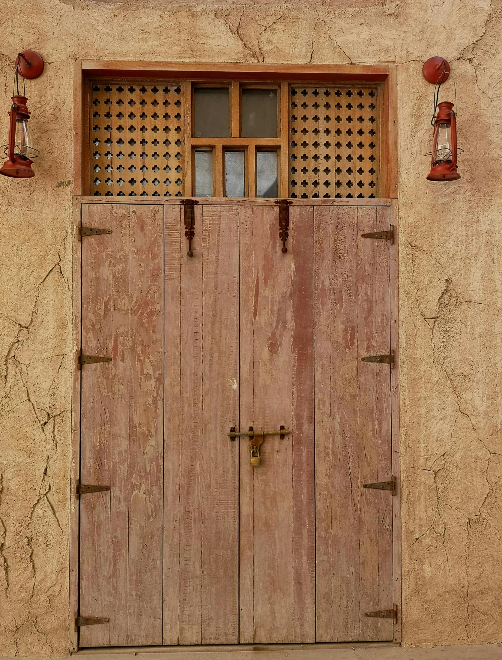 the side of a building with wood doors