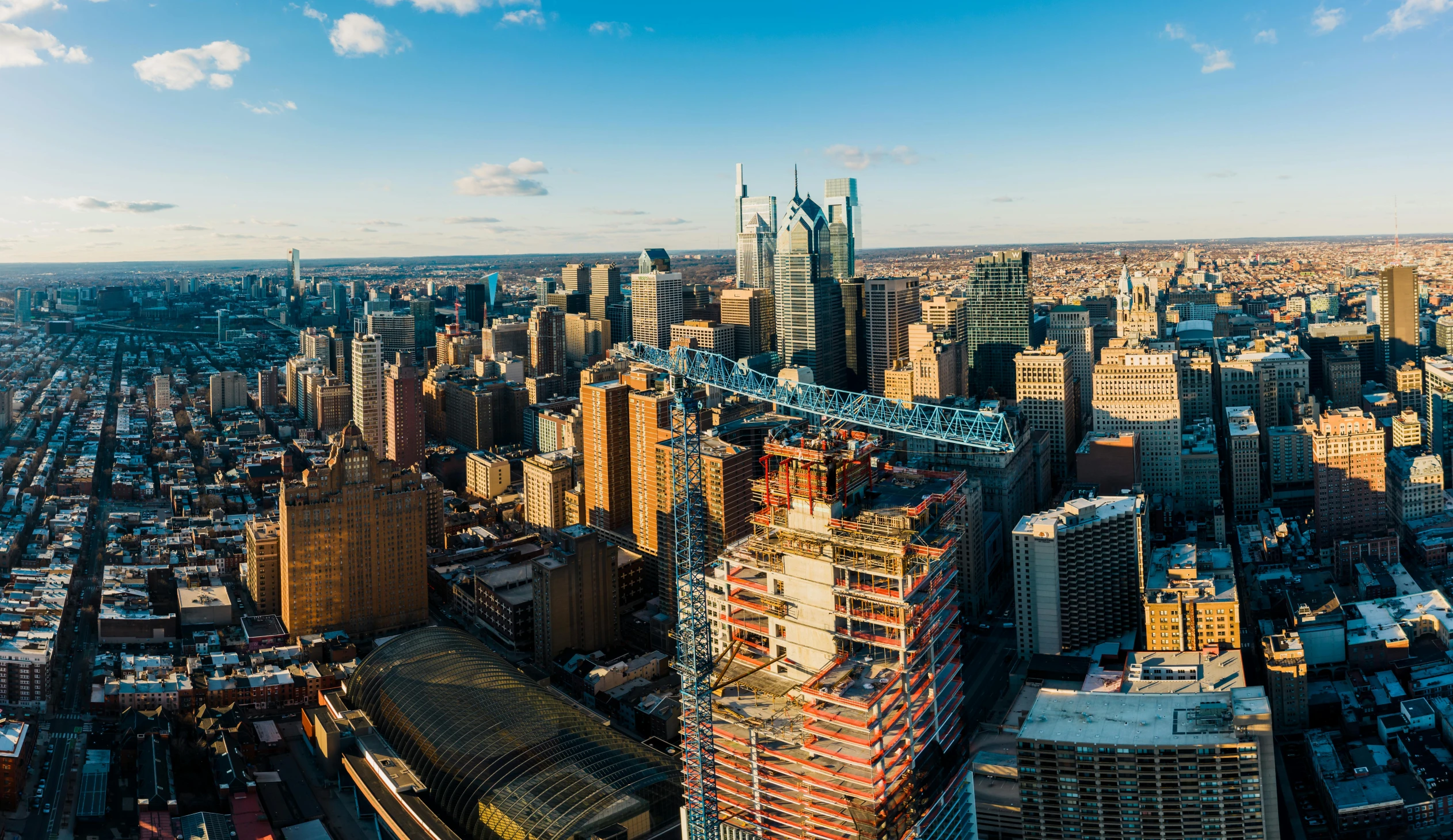 a city view with buildings and a large bridge