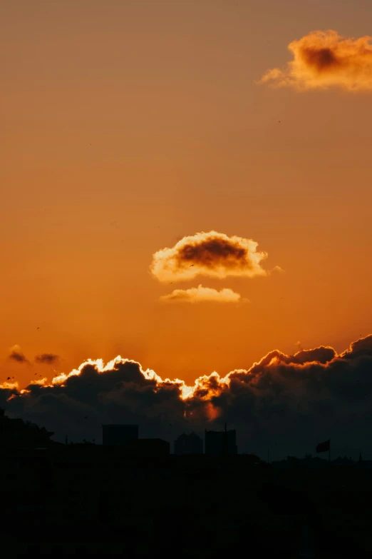 sunset with a plane flying low in the sky