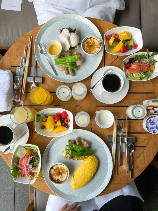 this is a table filled with a variety of breakfast items