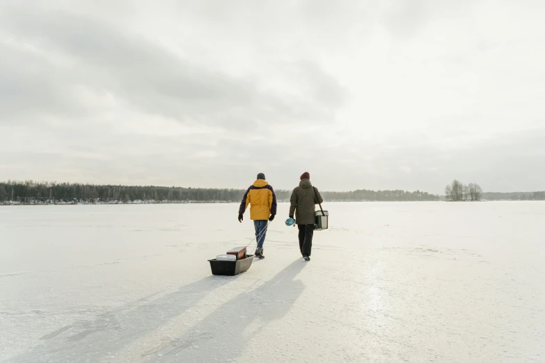 a couple is walking down the snow covered plain