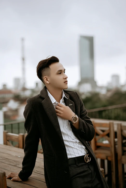 a young man leaning up against his jacket