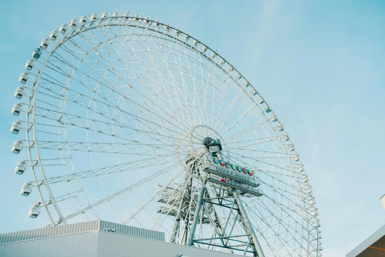 an enormous ferris wheel with people at top