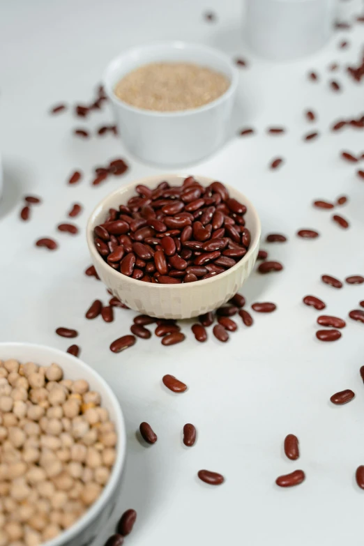 a couple of bowls filled with red beans