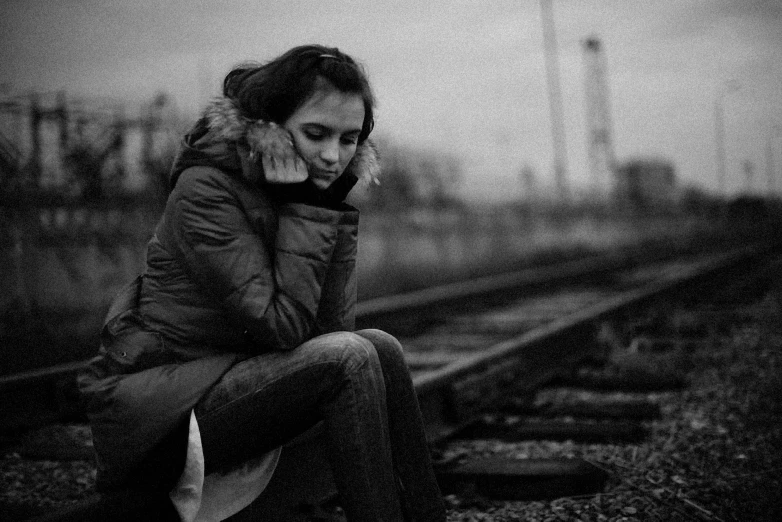 a black and white po of a woman on her cell phone