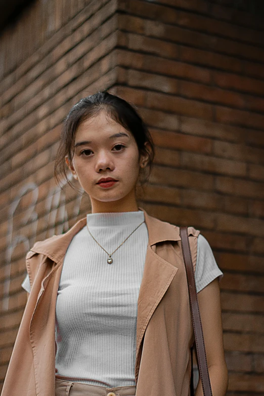 an image of a woman posing in front of a wall