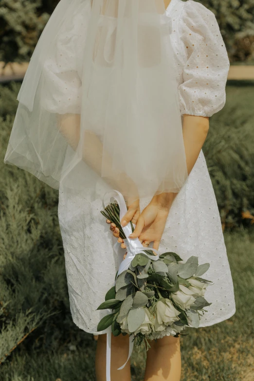 the bride has holding a bouquet of flowers