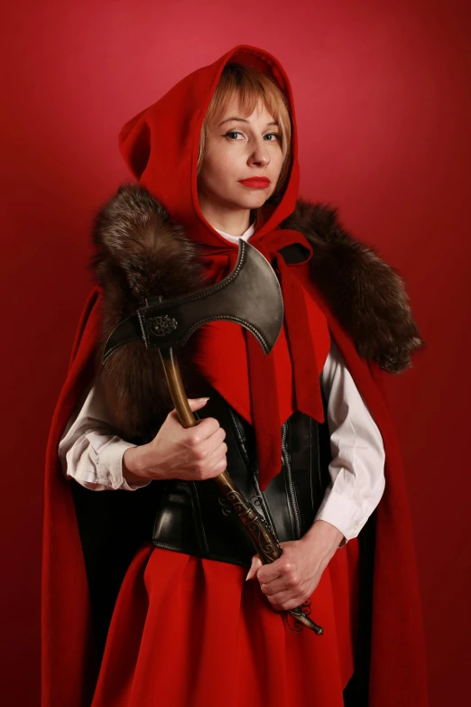 a girl dressed in a red and black costume