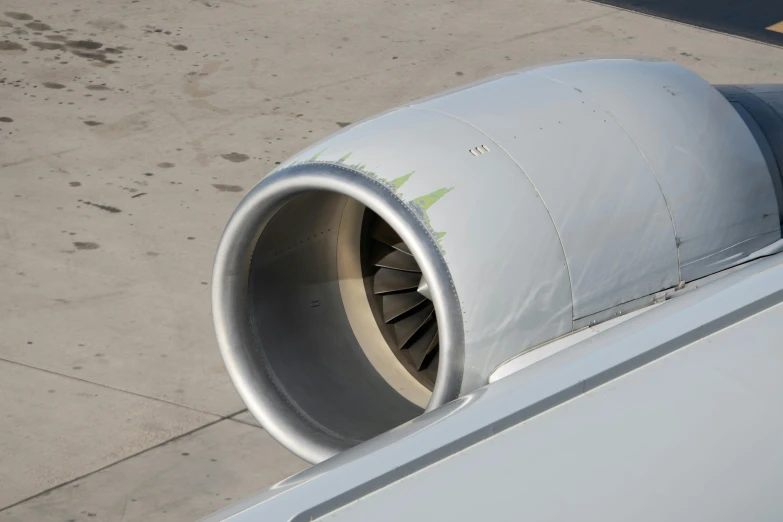 a large jet airplane engine with it's blades spread