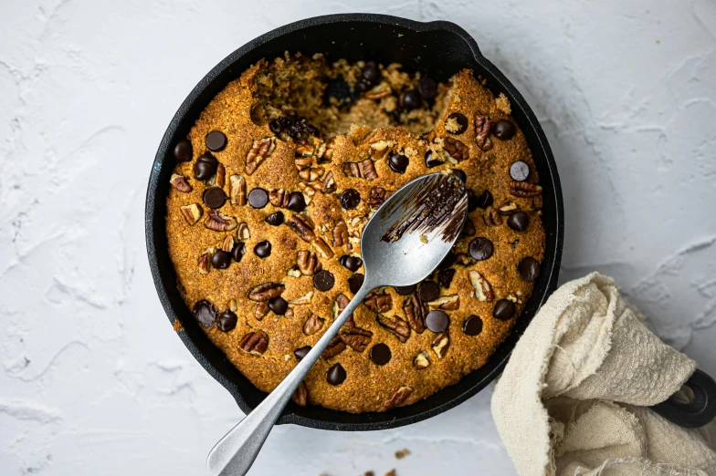 this is a close up of an oatmeal dish with pecans