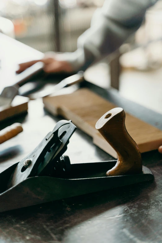 a pair of scissors are sitting next to some wood