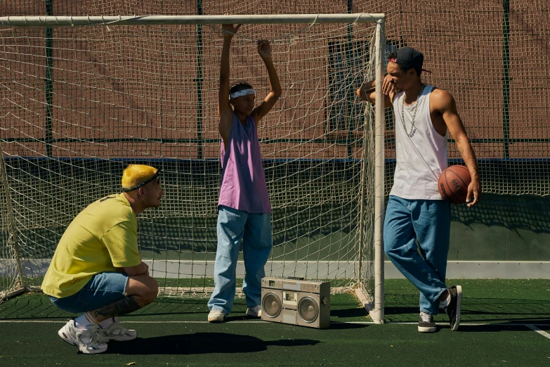 a group of people standing on top of a soccer field