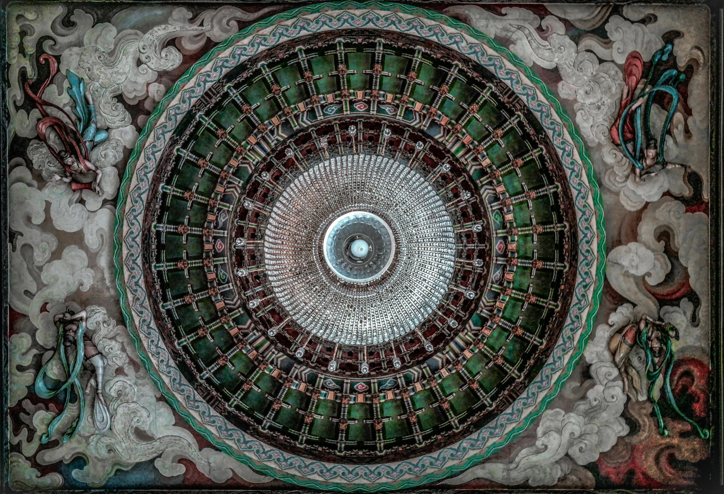 an intricately decorated ceiling with red, blue and green