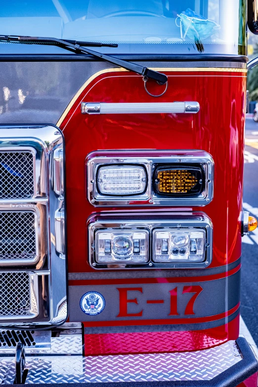 an old fire engine at a station parked by the curb