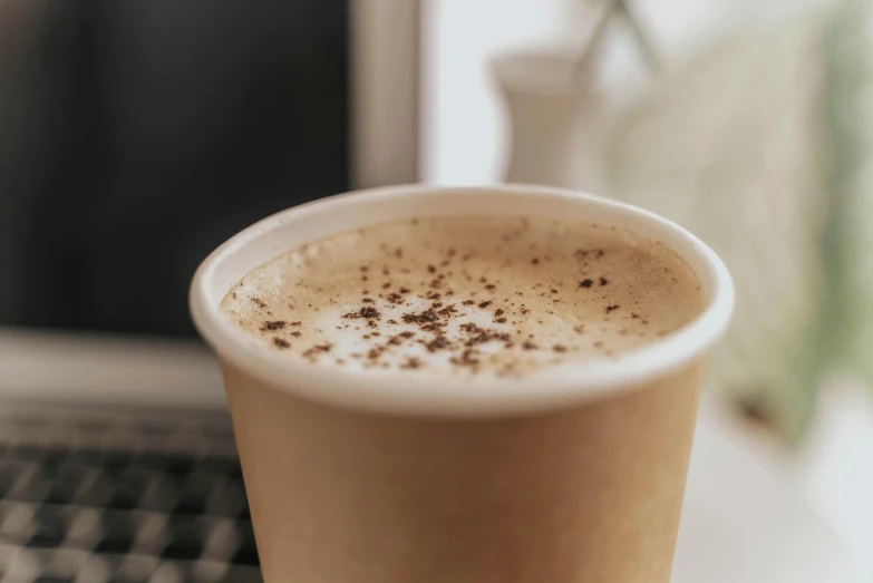 a cup of coffee that is sitting on the counter