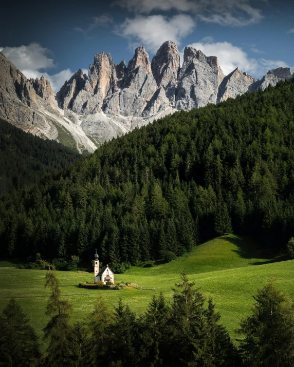 a scenic view of green hills and mountains