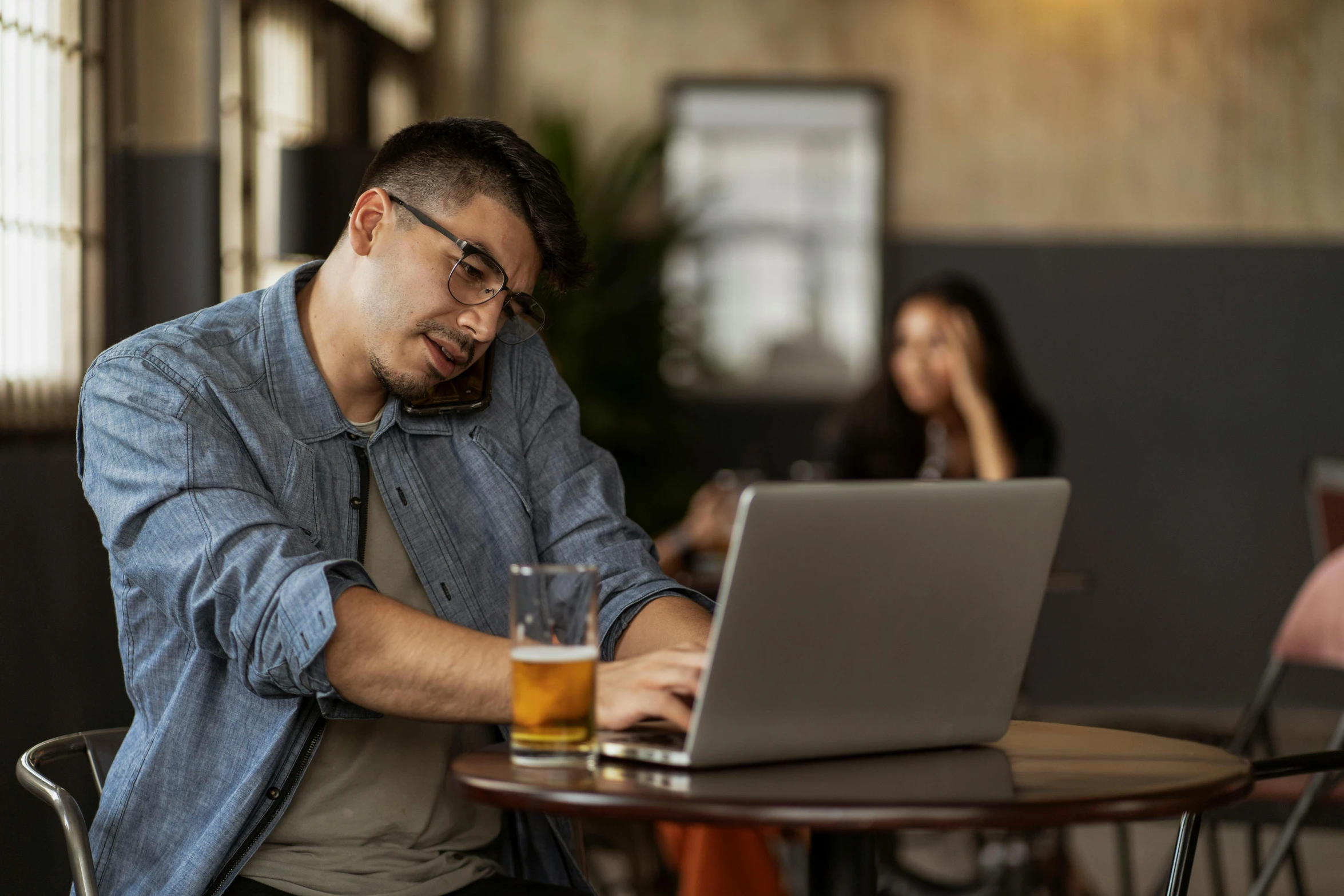 a man using his laptop at the restaurant