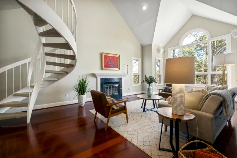 a staircase in a living room that is painted white