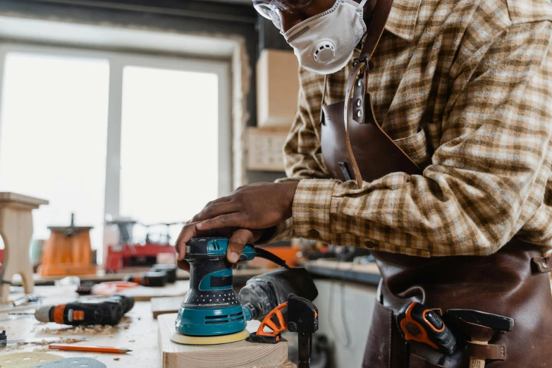 a person works on a piece of wood