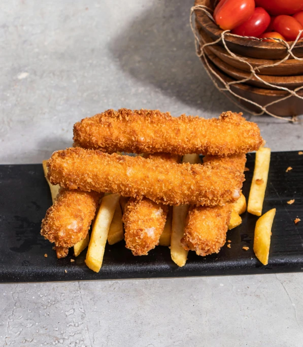 fried fish sticks are prepared for dipping