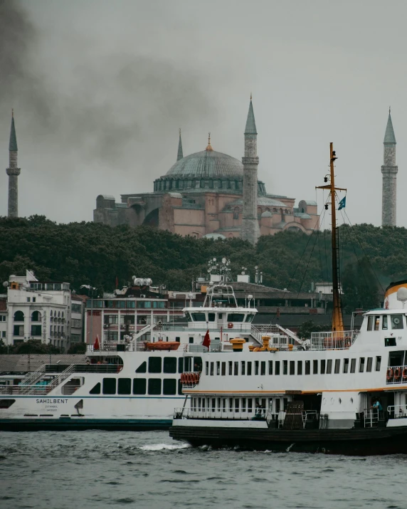 the two large passenger ferries have sails down