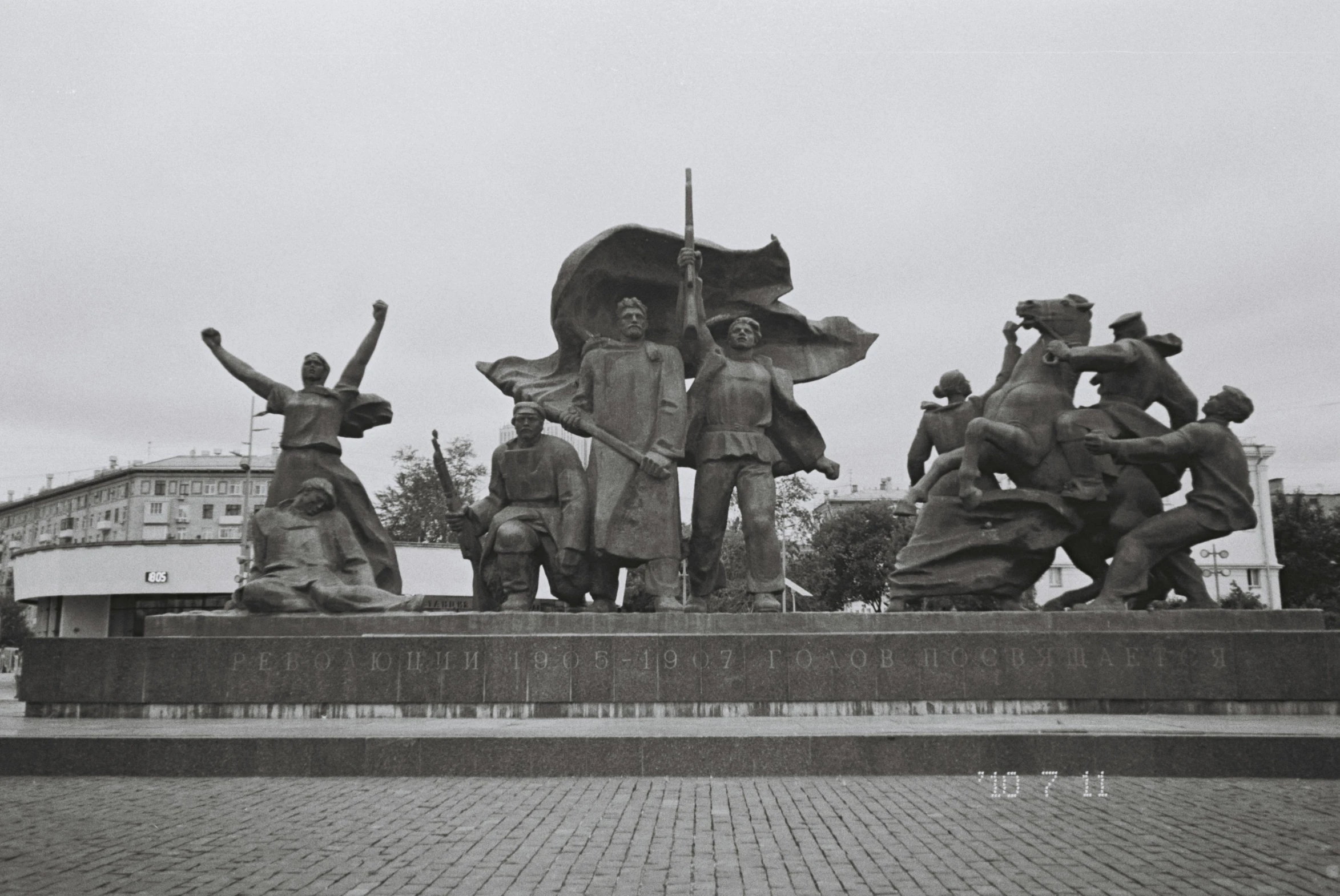 a statue with a lot of statues standing on it