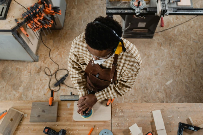 a man who is working on a project in his workshop