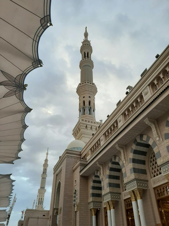 a dome covered building with pillars and arches