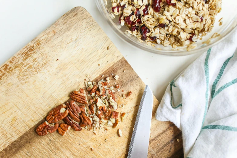 sliced and chopped nuts are on a  board