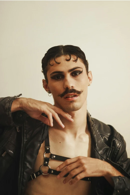 an image of man wearing leather jackets and mustache