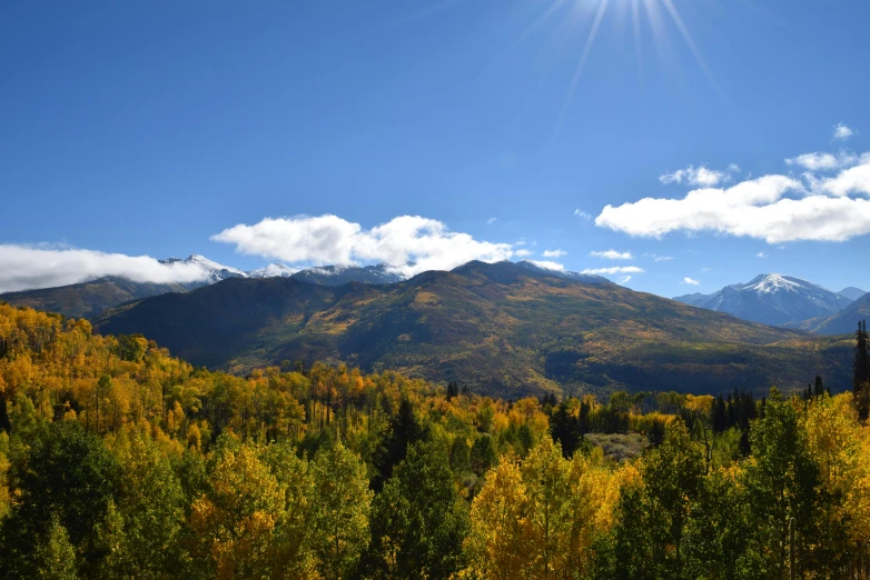 there is a mountain and sky that is in the background