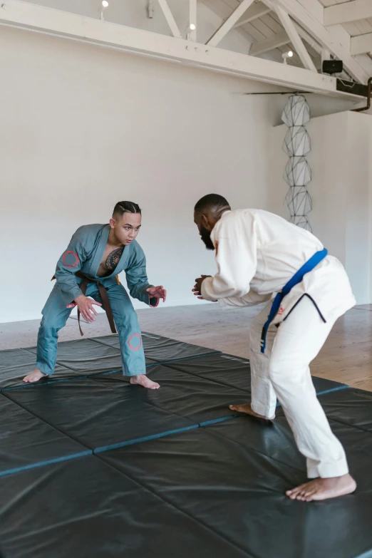 two men in karate attire near one another