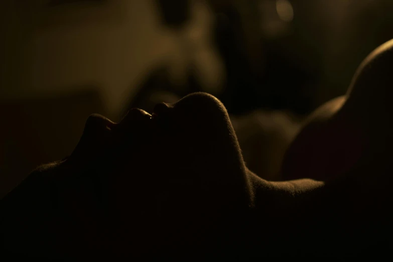 a woman is relaxing on her bed with her head propped up