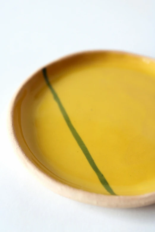 a close up view of a yellow and green plate