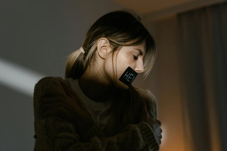 a girl wearing ear buds while using a phone