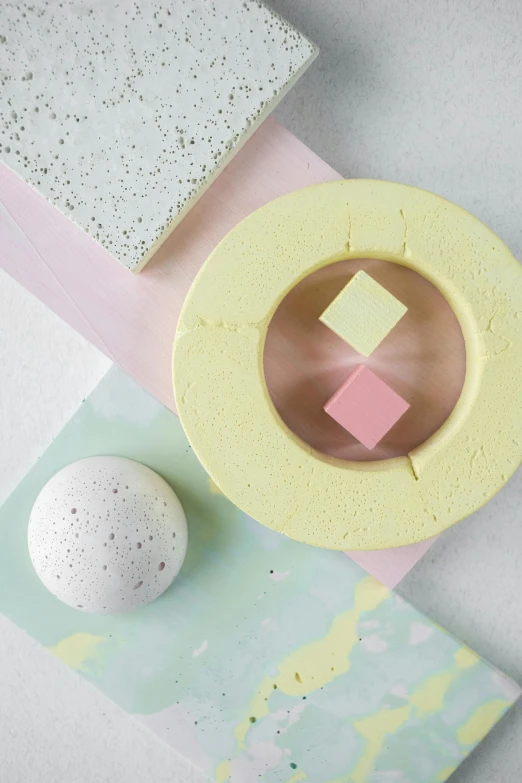 a pastel blue and white paper place mat and egg sitting on it