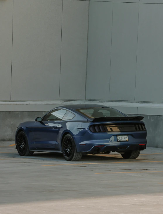 a mustang car parked in a parking lot